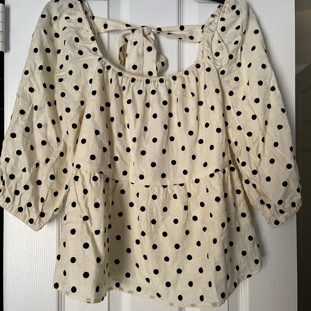 White blouse with black polka dots